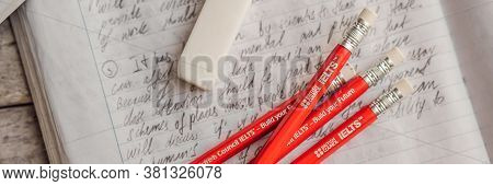 Vietnam, Nha Trang, 14.07.2020: Ielts Red Pencils And Essay Notebook For The English Exam Banner, Lo