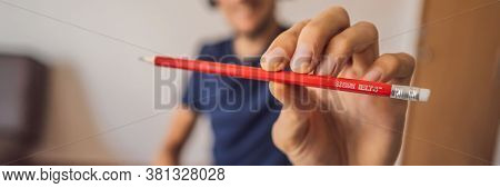 Vietnam, Nha Trang, 14.07.2020: A Man Prepares For The Ielts Exam Ielts Red Pencils, Reading Text An