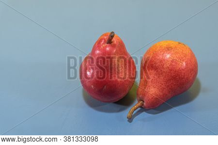 Pear Fruits (pyrus Comunis L.) Variety Red On Blue Background
