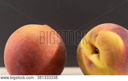 Peach Fruits (prunus Persica) In Natura On A Woody Background