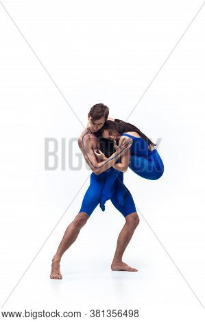 Loving Arms. Couple Of Modern Dancers, Art Contemp Dance, Blue And White Combination Of Emotions. Fl
