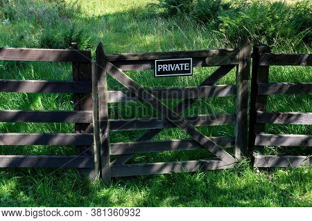Wooden Country Gate And Fence With Private Sign