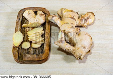 Ginger Root (zingiber Officinale) On Light And Woody Background