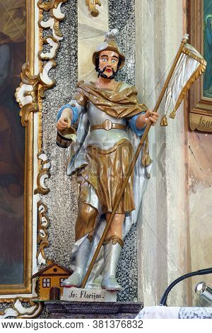 GORNJI DRAGANEC, CROATIA - OCTOBER 02, 2011: St. Florian statue on the altar of the Holy Trinity at the Church of the Visitation of the Blessed Virgin Mary in Gornji Draganec, Croatia