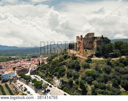 Aerial High Up Photography Drone Point Of View Of Ruins Of The Castle Of Montesa Located On Hillside