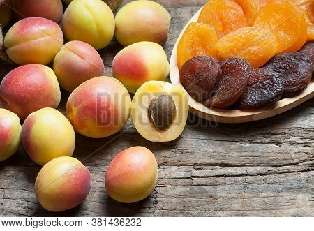 Natural Dried Apricots With Fresh Whole Ripe Apricot And Half In Bamboo Bowl On Rustic Table, Dry Ap