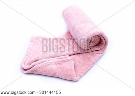 Rolled Up Red Coral Fleece Throw Isolated On White Background