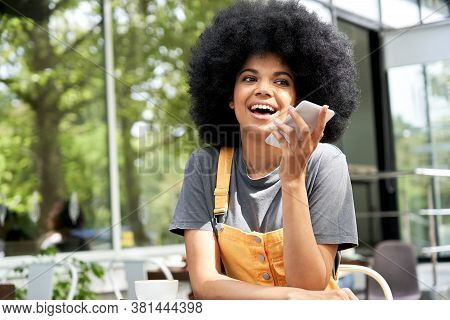 African Woman User Holding Mobile Phone In Hand Speak On Speakerphone Using Virtual Digital Voice Re