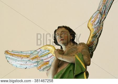 LOBOR, CROATIA - AUGUST 25, 2012: Angel statue on a high altar in the parish church of Saint Anne in Lobor, Croatia