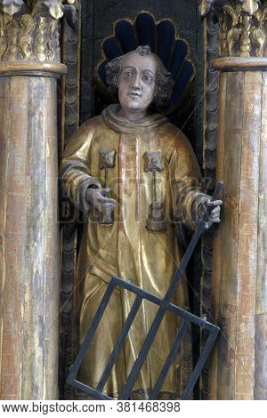 LOBOR, CROATIA - AUGUST 25, 2012: Saint Lawrence statue on a high altar at Our Lady of the Mountain Church in Lobor, Croatia