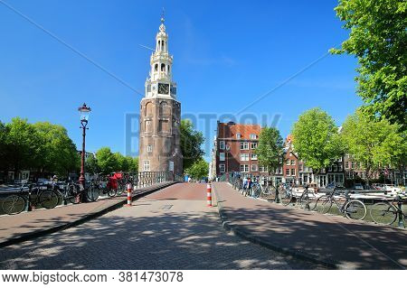 Montelbaanstoren Tower (built In 1516), Located Along Oudeshans Canal In Amsterdam Centrum, With A B