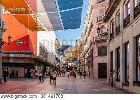 Madrid, Spain - August 15, 2020: View Of Preciados Street With Sunshades During Summer. It Is One Of