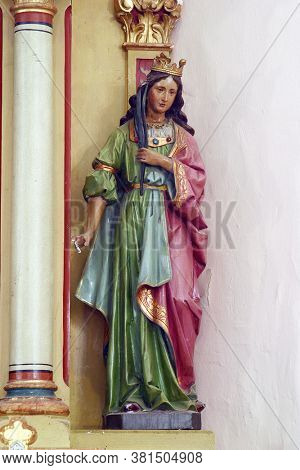 PESCENICA, CROATIA - SEPTEMBER 07, 2013: St. Catherine of Alexandria, statue on the altar of St. Barbara in the parish church of the Assumption of the Virgin Mary in Pescenica, Croatia