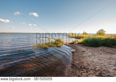 Vuoksa River Near Imatra In The Leningrad Region, Russia. Coastline With Pine Forest Reflected In Vu