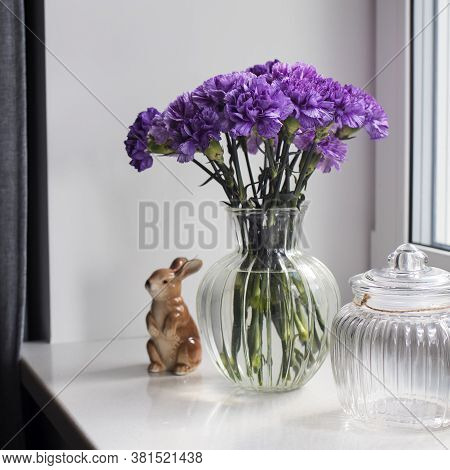 Bridal Bouquets Of Lilac Carnations In A Round Glass Vase Different Sizes As Table Decoration