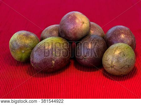 Pasiflora Fruits On Red Cloth Napkin Background