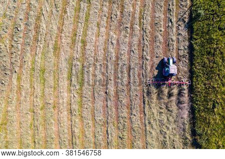 Top View Of Tractor With Tedders, Drying Mowed Hay