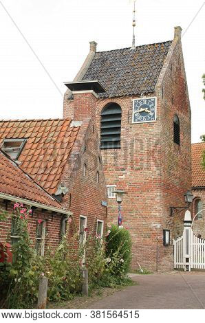 Ezinge.august-16-2020. The Tower Of The Church Of Ezinge And A Historic House In The Village Ezinge.