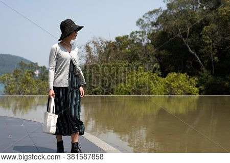 traveling woman walk at Xiangshan Visitor Center, Sun Moon Lake, Nantou, Taiwan