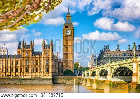 London Europe travel destination, Big Ben and Westminster parliament in autumn with foliage. Fall season landscape of famous city.