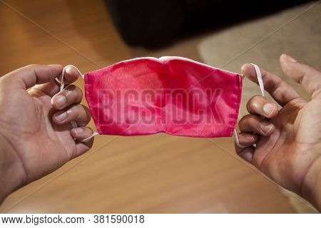 Putting The Mask On To Prevent Coronavirus In The Pandemic Period In Quarantine. \\\\nfirst Person V