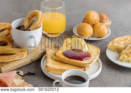 Spanish Breakfast, Churros With Chocolate,  Magdalena (spanish Cupcake) , Crusty  French Toast With 