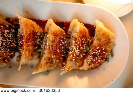Top View Closeup On Japanese Gedza Dumplings With Sauce