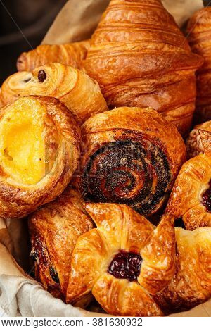 Closeup On Variety Of Sweet Fresh Baked Buns In A Basket