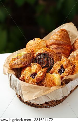 Closeup On Variety Of Sweet Fresh Baked Buns In A Basket