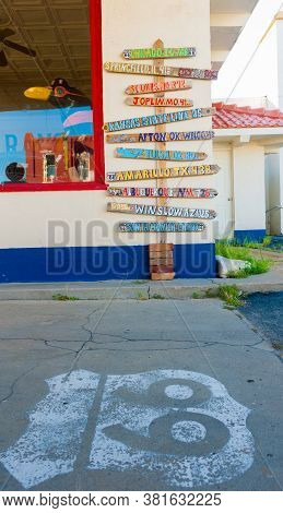Afton Usa - September 8 2015; Rustic Direction Sign In Afton, Point Way To Route 66 Towns On Outside