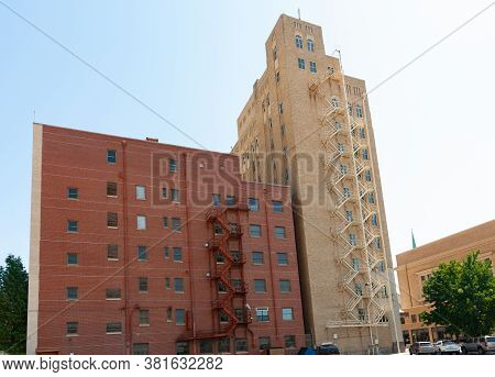 Two Apartment Building Standing Together Of Different Color Brick Construction With Old-fashioned Ex