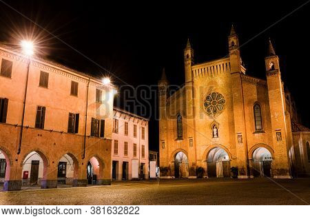 Piazza Risorgimento, Main Square Of Alba (piedmont, Italy) At Night, With The Facade Of Saint Lawren