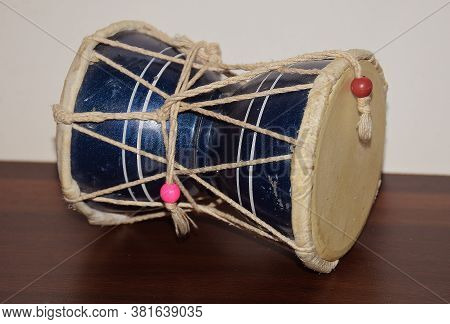 Damaru Is A Small Two-headed Drum Which Is Also The Instrument Of The Deity Lord Shiva And Considere