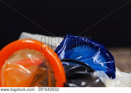 A Whole Blue Latex Condom, A Means To Prevent Pregnancy And Infection, Close-up And Small Depth Of F