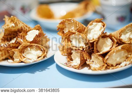 Yellow Waffle Rolls With White Curd Cream