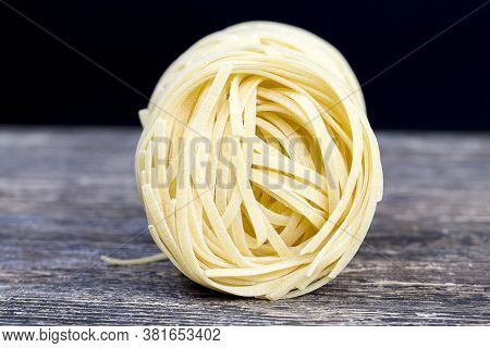 Twisted Into The Form Of A Slot, One Serving Of This Noodle From Wheat Flour, Closeup