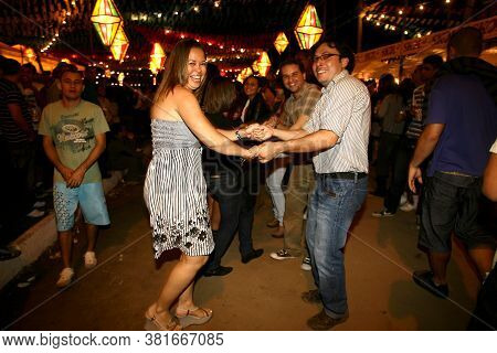Ilheus, Bahia / Brazil - June 23, 2011: People Are Seen Dancing Forro And Hillbilly Dresses During S