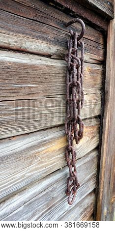 Old Antique Chain Hanging On A Wall