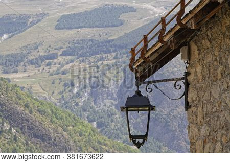 A Street Lamp Under The Roof Of A Traditional Mountain House