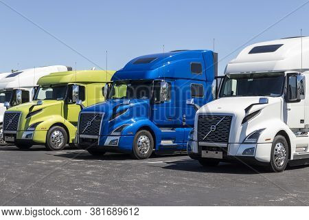 Indianapolis - Circa August 2020: Volvo Semi Tractor Trailer Trucks Lined Up For Sale. Volvo Is One 