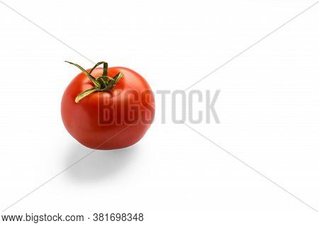 Red Tomato On A White Background. One Tomato. Tomato With Drops