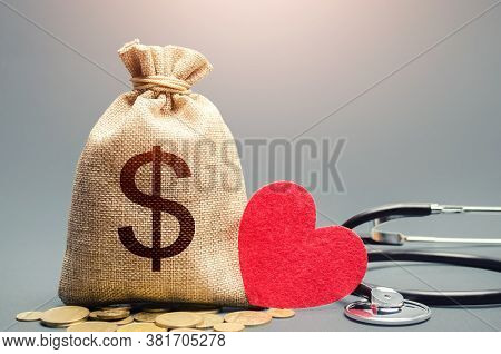 Dollar Money Bag And Stethoscope. Health Life Insurance And Financing Concept. Funding Healthcare Sy