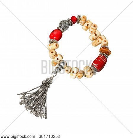 Women`s Wrist Bracelet Of Silver, Yellow And Red Beads On White Background. Top View
