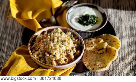 South Indian Breakfast Savory Vegetable Semolina Porridge Rava Upma With Green Mint Chutney And Para