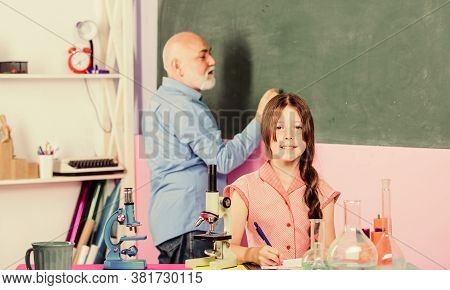 Back To School. School Lesson. Excellent Pedagogue Friendly Kind. Little Girl With Man Tutor Study S