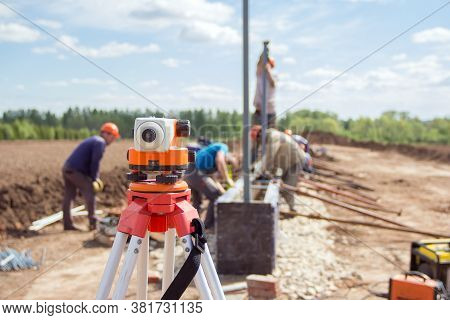 Construction Equipment. Surveyors Equipment Theodolite On The Construction Site. Monitoring The Prog