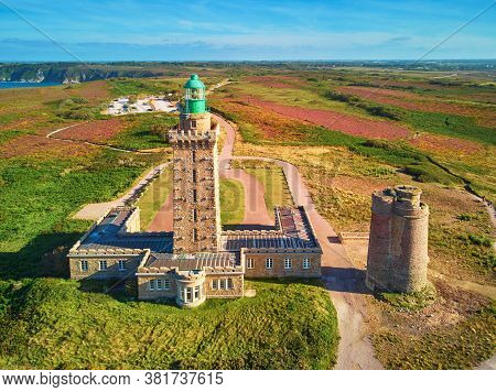 Scenic View Of Cape Frehel With Its Lighthouse, One Of The Most Popular Tourist Destinations In Brit