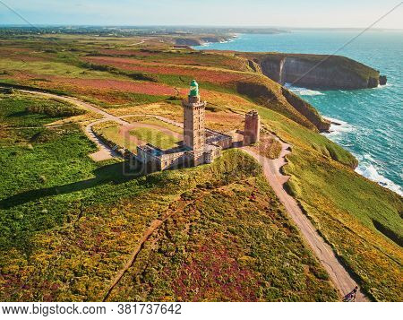 Scenic View Of Cape Frehel With Its Lighthouse, One Of The Most Popular Tourist Destinations In Brit