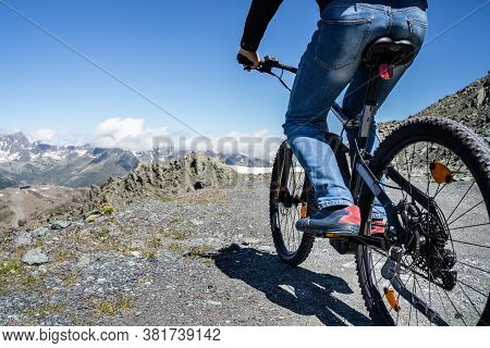 Man Riding Electric Mountain Bike Or E Bike In Alps