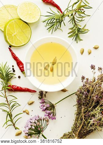 Herbs And Spices On White Wooden Background. Shallow Dof.